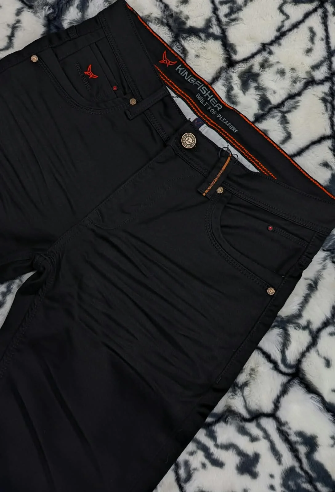 Denim jacket on wooden hanger